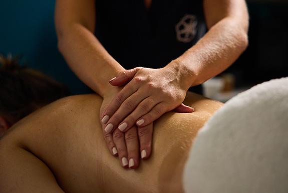 Person lying down having a back massage