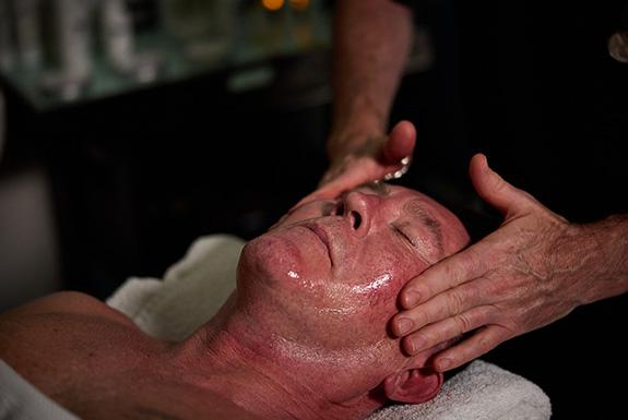 Person lying down having a facial