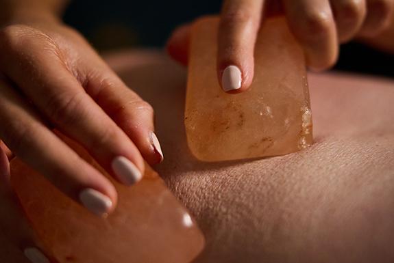 Person having a himalayan salt massage