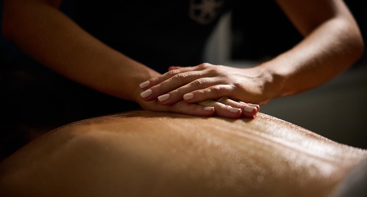 Person lying down having a back massage